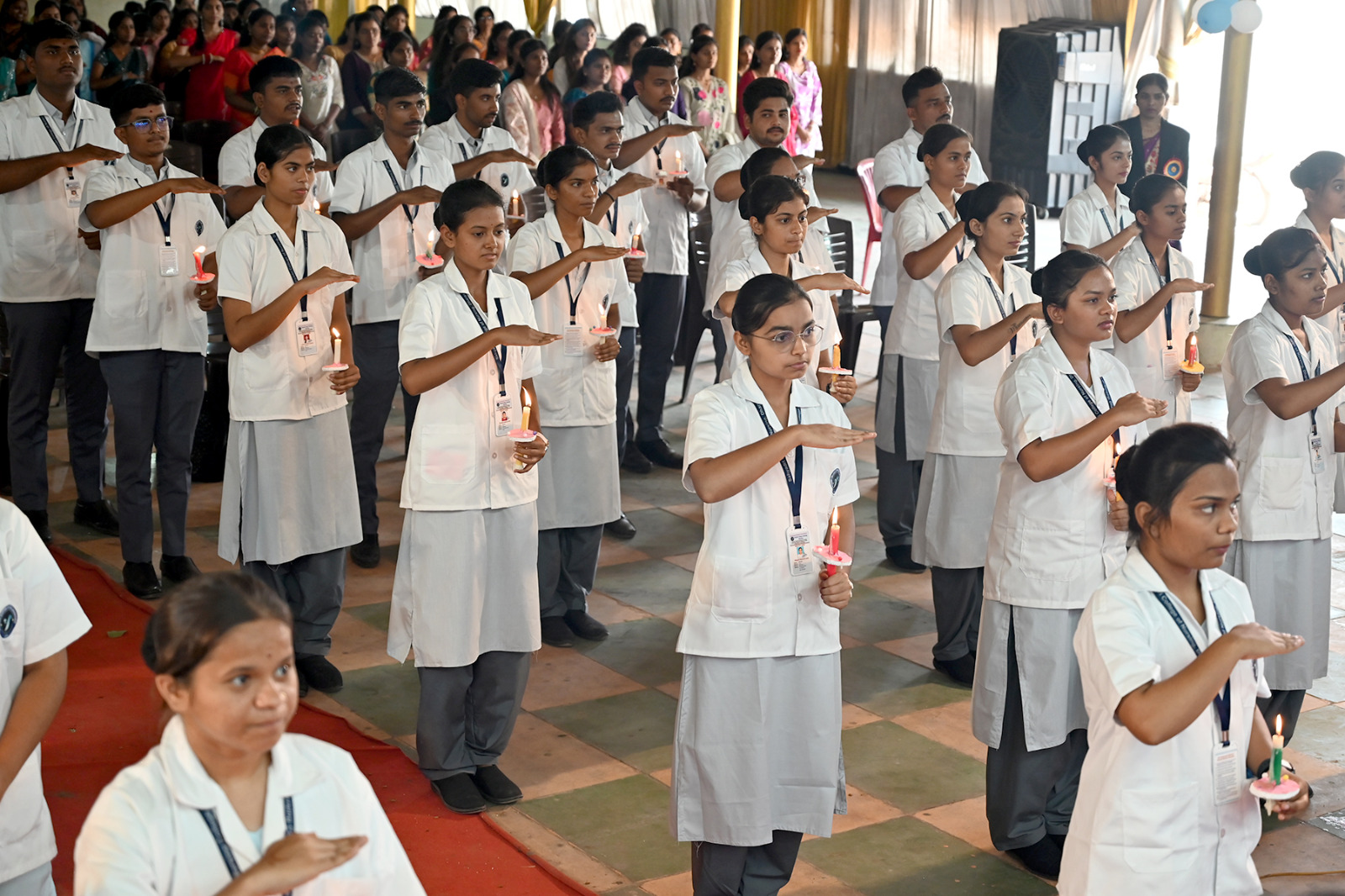 Nursing students taking part in a ceremony at Sahyadri College of Nursing